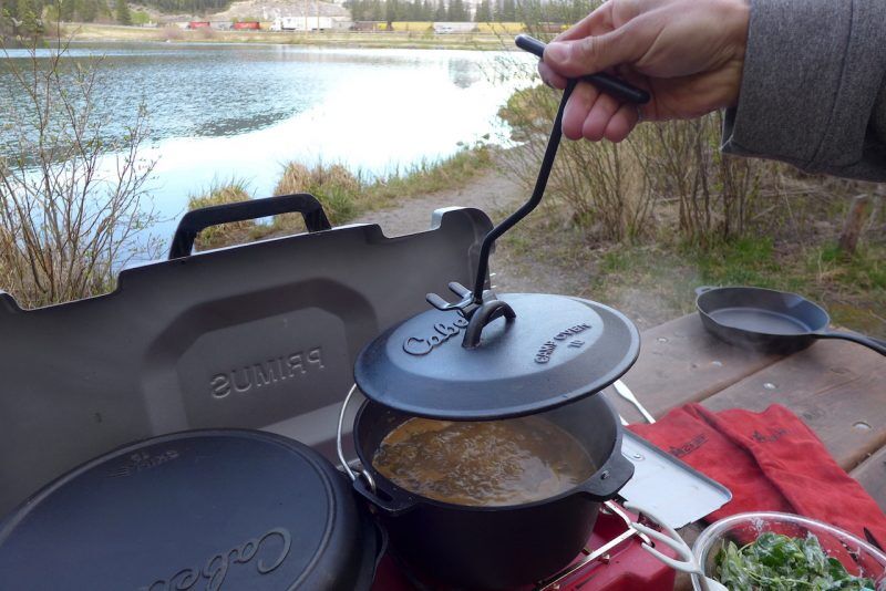Showing the dutch oven lifting tool Cabela's cast iron cookware 