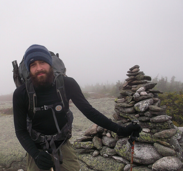 hiker wearing gloves in windy weather