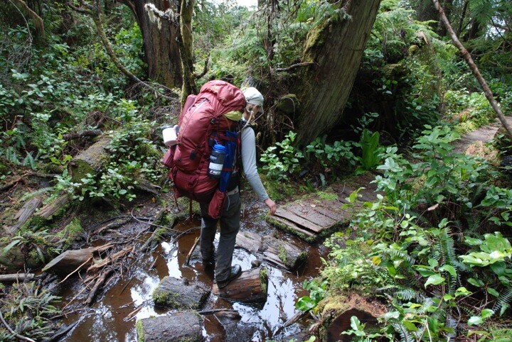 alicja crossing muddy trail on west coast trail
