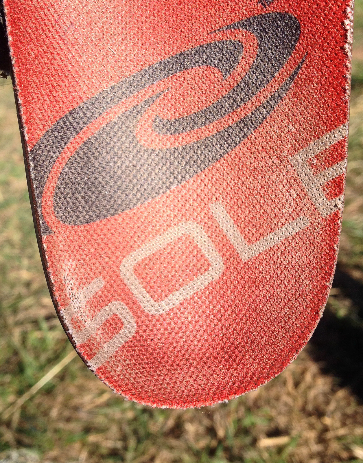 old insole showing wear on heel