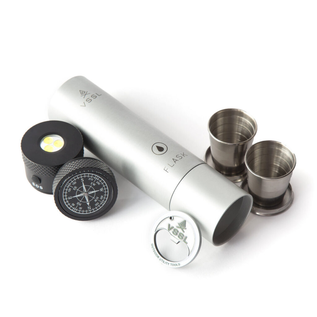 The VSSL flashlight features two collapsible shot glasses, bottle opener and compass.