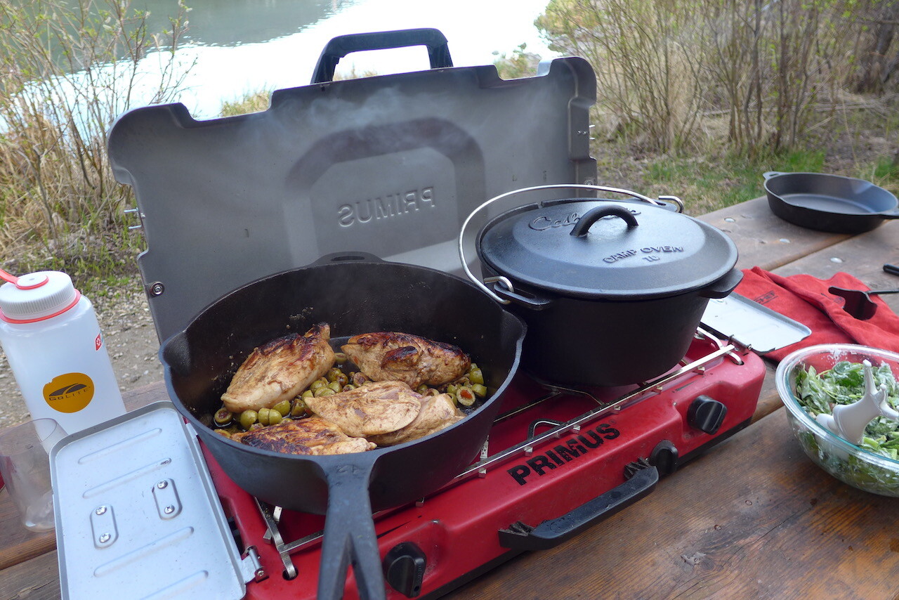 Cooking chicken and stew with Cabela's cast iron cookware on a propane stove